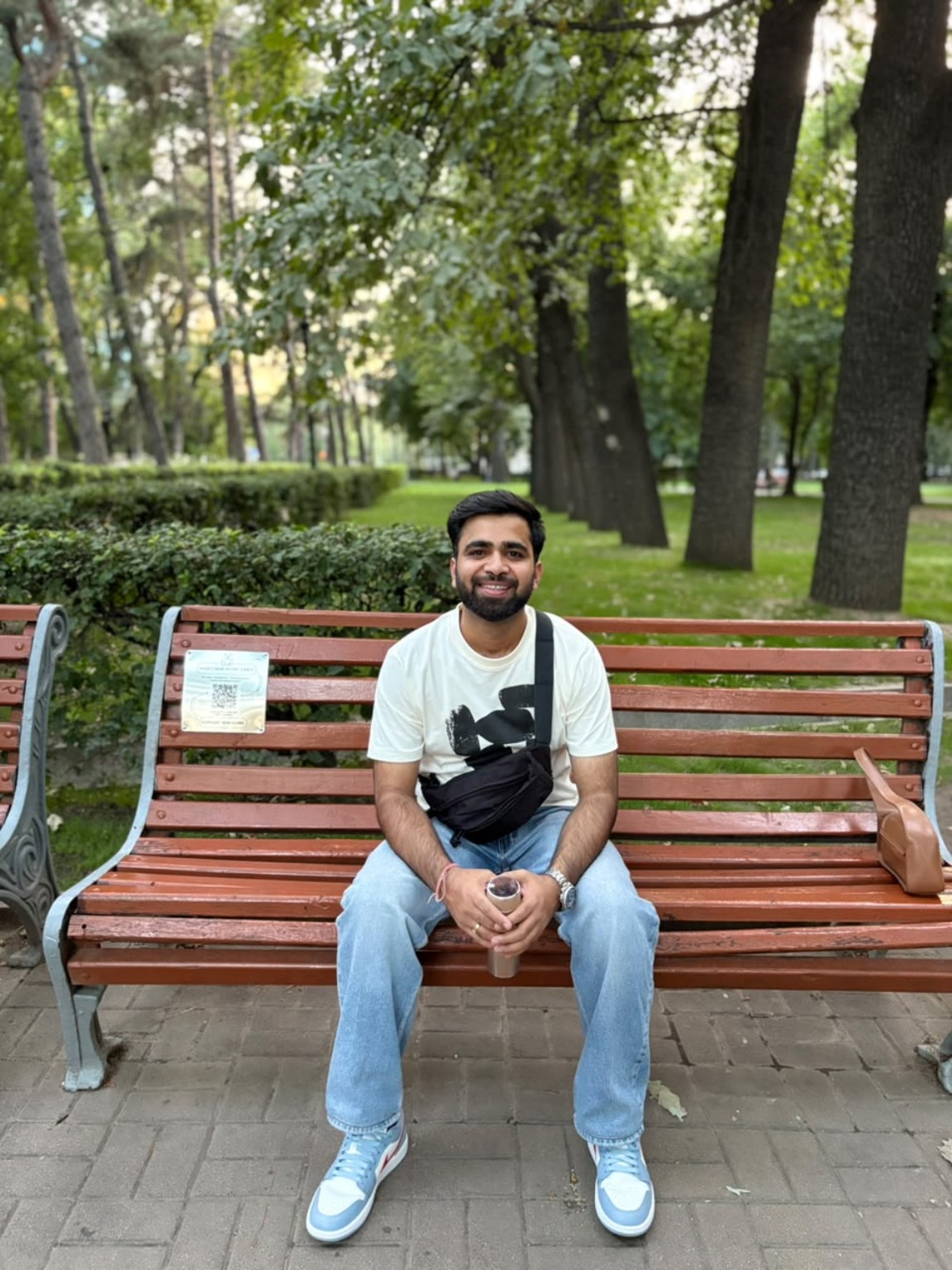 Kuldeep sitting outdoors